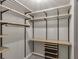 Walk-in closet featuring wood and metal shelving and pull-out drawers at 1628 Briarcliff Ne Rd # 15, Atlanta, GA 30306