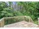 Wooden deck with natural views of surrounding foliage and trees at 2722 Springside Ct, Douglasville, GA 30135