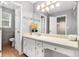 Well-lit bathroom with white cabinets, neutral countertop, and ceramic tile flooring at 2722 Springside Ct, Douglasville, GA 30135