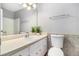 Bathroom with white cabinets, neutral countertops, and a tiled backsplash at 2722 Springside Ct, Douglasville, GA 30135
