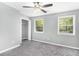 Bright bedroom with two windows, neutral carpet, and closet at 2722 Springside Ct, Douglasville, GA 30135