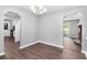 This dining room features hardwood floors and elegant lighting perfect for entertaining at 2722 Springside Ct, Douglasville, GA 30135
