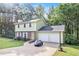 Well-kept two-story house with a two-car garage and an expansive driveway at 2722 Springside Ct, Douglasville, GA 30135