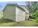 Home exterior with green siding, a concrete foundation, and a wooden deck at 2722 Springside Ct, Douglasville, GA 30135