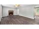 Spacious living room with hardwood floors and a brick fireplace at 2722 Springside Ct, Douglasville, GA 30135