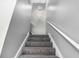 This staircase has neutral carpet and bright white trim, and modern orb lighting at 2722 Springside Ct, Douglasville, GA 30135