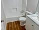 Bathroom features a toilet, modern vanity and a bathtub with a shower at 3988 Chimney Ridge Dr, Ellenwood, GA 30294