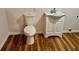 Bathroom features a sink vanity with storage and white fixtures at 3988 Chimney Ridge Dr, Ellenwood, GA 30294