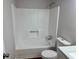 Bright bathroom features a bathtub with a shower and toilet at 3988 Chimney Ridge Dr, Ellenwood, GA 30294