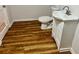 Bathroom features a toilet, modern vanity and laminate floors at 3988 Chimney Ridge Dr, Ellenwood, GA 30294