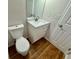 Modern bathroom featuring a white vanity, a mirror and a toilet at 3988 Chimney Ridge Dr, Ellenwood, GA 30294