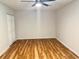 Bedroom with hardwood floors and a ceiling fan creates a comfortable and stylish living space at 3988 Chimney Ridge Dr, Ellenwood, GA 30294