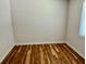 Bedroom with hardwood floors and a window providing natural light, creating a cozy and inviting space at 3988 Chimney Ridge Dr, Ellenwood, GA 30294
