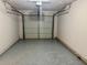 A garage with epoxy flooring and an overhead door at 3988 Chimney Ridge Dr, Ellenwood, GA 30294