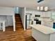Bright kitchen featuring white cabinets, stainless steel appliances and an island at 3988 Chimney Ridge Dr, Ellenwood, GA 30294