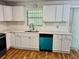 Bright kitchen featuring white cabinets, quartz countertops, an island, and modern stainless steel appliances at 3988 Chimney Ridge Dr, Ellenwood, GA 30294