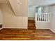 Bright living room featuring stairs and laminate floors at 3988 Chimney Ridge Dr, Ellenwood, GA 30294