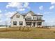 Beautiful two story home featuring a brick exterior, landscaped front yard, and classic architectural details at 719 Hedwig Dr, Mcdonough, GA 30252