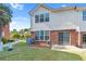 Cozy backyard with manicured lawn, brick accents, and a small patio area, great for outdoor relaxation at 988 Treymont Way, Lawrenceville, GA 30045