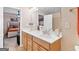 Bright bathroom featuring a double vanity with views of the bedroom at 988 Treymont Way, Lawrenceville, GA 30045