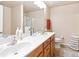 Bathroom featuring a double vanity, ample counter space, and a glass-enclosed shower for a spa-like experience at 988 Treymont Way, Lawrenceville, GA 30045