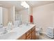 Bathroom featuring a double vanity, ample counter space, and a glass-enclosed shower for a spa-like experience at 988 Treymont Way, Lawrenceville, GA 30045