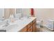 Well-lit bathroom featuring a double vanity and modern fixtures at 988 Treymont Way, Lawrenceville, GA 30045