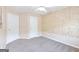 Bedroom features a neutral color palette, carpet floors, and two closets at 988 Treymont Way, Lawrenceville, GA 30045