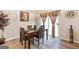 Dining area with table, chairs, rug, decorative bottle and natural light at 988 Treymont Way, Lawrenceville, GA 30045