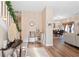 Bright entryway with hardwood floors, soft neutral walls and sightlines into the dining and living room at 988 Treymont Way, Lawrenceville, GA 30045