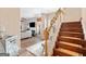 Foyer featuring wooden stairs, decorative rug, views into the living room and a mirrored table at 988 Treymont Way, Lawrenceville, GA 30045