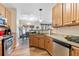 Efficient kitchen with updated cabinets and appliances, and a view into the dining area at 988 Treymont Way, Lawrenceville, GA 30045