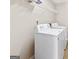 Efficient laundry area with white appliances and ample storage space at 988 Treymont Way, Lawrenceville, GA 30045