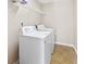 Functional laundry room with washer and dryer, offering convenience and efficiency for household chores at 988 Treymont Way, Lawrenceville, GA 30045
