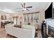 Bright living room showcases a fireplace, ceiling fan, recessed lighting, and an open layout to the dining area at 988 Treymont Way, Lawrenceville, GA 30045