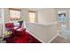 Cozy nook with a red chair, ottoman and decorative artwork at 988 Treymont Way, Lawrenceville, GA 30045