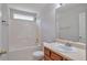 Bathroom featuring vanity with storage, tub/shower and toilet at 1015 Lakeside Cir, Covington, GA 30016