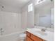 Bathroom featuring single vanity and tub with shower at 1015 Lakeside Cir, Covington, GA 30016