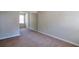 Bedroom featuring mirrored sliding door closet and neutral paint and carpet at 1015 Lakeside Cir, Covington, GA 30016