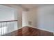 Bonus Room featuring hardwood floors, neutral paint, and access to multiple areas at 1015 Lakeside Cir, Covington, GA 30016