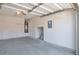 Spacious garage with a smooth concrete floor and ample storage space at 1015 Lakeside Cir, Covington, GA 30016