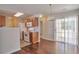 Eat-in kitchen with stainless steel appliances, wood cabinets, and a sliding glass door at 1015 Lakeside Cir, Covington, GA 30016