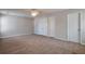 Large primary bedroom with carpet and dual closets at 1015 Lakeside Cir, Covington, GA 30016