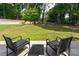 Spacious backyard with a table and chairs, perfect for outdoor entertaining and relaxation at 130 Lacey Oak Ln, Loganville, GA 30052