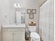 A cozy bathroom offering white fixtures and decorative wall art at 130 Lacey Oak Ln, Loganville, GA 30052