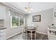 Cozy breakfast area features a dining table set near a bright window at 130 Lacey Oak Ln, Loganville, GA 30052