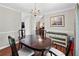 Formal dining room featuring an elegant chandelier and classic decor at 130 Lacey Oak Ln, Loganville, GA 30052