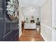 Inviting entryway flowing into a living room with a fireplace as the focal point at 130 Lacey Oak Ln, Loganville, GA 30052