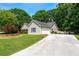 View of the exterior of this well maintained home with attached two car garage at 130 Lacey Oak Ln, Loganville, GA 30052