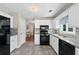 Bright kitchen features stainless steel appliances, granite countertops, and ample cabinet space at 130 Lacey Oak Ln, Loganville, GA 30052